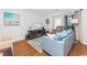 Living area with hardwood floors, comfy seating and large TV at 1101 Possum Trot Rd. # C205, North Myrtle Beach, SC 29582
