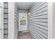 Inviting condo entryway with a door and decorative mat at 1101 Possum Trot Rd. # C205, North Myrtle Beach, SC 29582