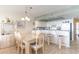 Kitchen dining area with table and chairs, adjacent to kitchen at 4001 S Ocean Blvd. # Apt 2C, North Myrtle Beach, SC 29582