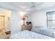 Bright bedroom with two twin beds, dresser, and access to a bathroom at 4001 S Ocean Blvd. # Apt 2C, North Myrtle Beach, SC 29582