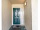 Inviting condo entry with teal door and sidelight at 4001 S Ocean Blvd. # Apt 2C, North Myrtle Beach, SC 29582