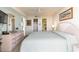 Main bedroom with king bed, dresser, and access to bathroom at 4001 S Ocean Blvd. # Apt 2C, North Myrtle Beach, SC 29582
