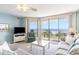 Living room with ocean view and balcony access at 4001 S Ocean Blvd. # Apt 2C, North Myrtle Beach, SC 29582