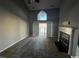 Living room with fireplace, high ceiling, and access to balcony with water views at 3831 Masters Ct. # 137, Myrtle Beach, SC 29577