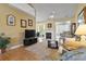 Bright living room with hardwood floors, fireplace, and ample seating at 490 Blackberry Ln., Myrtle Beach, SC 29579