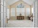 Bright sunroom features tile flooring, a ceiling fan, and multiple windows at 490 Blackberry Ln., Myrtle Beach, SC 29579