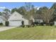 Charming one-story house with attached garage and manicured lawn at 490 Blackberry Ln., Myrtle Beach, SC 29579