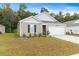 House exterior with a two-car garage and manicured lawn at 338 Spruce Pine Way, Conway, SC 29526
