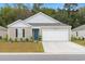One-story house with a two-car garage and well-maintained lawn at 338 Spruce Pine Way, Conway, SC 29526