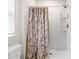 Clean shower with marble-patterned curtain at 338 Spruce Pine Way, Conway, SC 29526