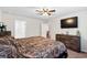 Main bedroom with king-size bed and en-suite bathroom at 338 Spruce Pine Way, Conway, SC 29526