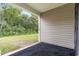 Small patio with black mat and view of backyard greenery at 338 Spruce Pine Way, Conway, SC 29526