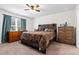 Comfortable main bedroom with a king-size bed and dresser at 338 Spruce Pine Way, Conway, SC 29526