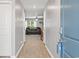 Bright entryway with hardwood floors leading to the living room at 338 Spruce Pine Way, Conway, SC 29526