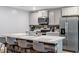 Modern kitchen with an island, stainless steel appliances, and breakfast bar at 338 Spruce Pine Way, Conway, SC 29526