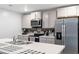 Modern kitchen with stainless steel appliances and an island at 338 Spruce Pine Way, Conway, SC 29526