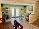 Bright living room features hardwood floors, comfy seating, and access to a patio at 1025 Carolina Rd. # F2, Conway, SC 29526