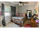 Cozy bedroom with full-size bed, ceiling fan, and window coverings at 1025 Carolina Rd. # F2, Conway, SC 29526