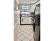 Cozy kitchen with white cabinets, black appliances, and tile flooring at 1025 Carolina Rd. # F2, Conway, SC 29526