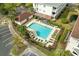 Elevated view of community pool with surrounding lounge chairs at 5750 Oyster Catcher Dr. # 1134, North Myrtle Beach, SC 29582