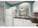 Kitchen with white cabinets, granite counters, and breakfast bar at 5750 Oyster Catcher Dr. # 1134, North Myrtle Beach, SC 29582