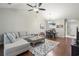 Open concept living room with sectional sofa and access to balcony at 5750 Oyster Catcher Dr. # 1134, North Myrtle Beach, SC 29582