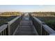 Wooden boardwalk leads to sandy beach at 5801 Oyster Catcher Dr. # 413, North Myrtle Beach, SC 29582