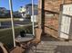 Screened porch with wicker furniture and small table at 5801 Oyster Catcher Dr. # 413, North Myrtle Beach, SC 29582