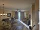 Open living space with comfy seating, hardwood floors, and access to a patio at 5801 Oyster Catcher Dr. # 413, North Myrtle Beach, SC 29582