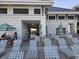 Community pool area with lounge chairs and tables at 5801 Oyster Catcher Dr. # 413, North Myrtle Beach, SC 29582