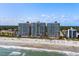 Aerial view of beachfront high-rise condos with ocean and beach at 2701 S Ocean Blvd. # 1817, North Myrtle Beach, SC 29582