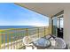 Balcony with yellow railings, table and chairs, and an ocean view at 2701 S Ocean Blvd. # 1817, North Myrtle Beach, SC 29582
