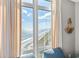 Stunning ocean view from large window, beach and blue sky visible at 2701 S Ocean Blvd. # 1817, North Myrtle Beach, SC 29582