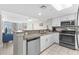Modern kitchen with white cabinets, stainless steel appliances, and ocean view at 2701 S Ocean Blvd. # 1817, North Myrtle Beach, SC 29582