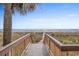 Wooden boardwalk leads to sandy beach at 2701 S Ocean Blvd. # 1817, North Myrtle Beach, SC 29582