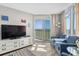 Living room with ocean view, comfy blue sofas and large TV at 2701 S Ocean Blvd. # 1817, North Myrtle Beach, SC 29582