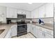 Modern kitchen with white cabinets, stainless steel appliances and granite countertops at 2701 S Ocean Blvd. # 1817, North Myrtle Beach, SC 29582