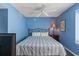 Bedroom with king-size bed, ceiling fan, and blue walls at 1625 S Ocean Blvd. # 1305, North Myrtle Beach, SC 29582