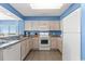 White kitchen with granite countertops and stainless steel appliances at 1625 S Ocean Blvd. # 1305, North Myrtle Beach, SC 29582