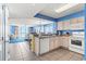 Well-equipped kitchen featuring granite counters and white appliances at 1625 S Ocean Blvd. # 1305, North Myrtle Beach, SC 29582