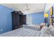 Bedroom with two double beds, ceiling fan, and blue walls at 1625 S Ocean Blvd. # 1305, North Myrtle Beach, SC 29582