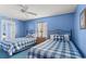 Bedroom with two double beds, ceiling fan, and blue walls at 1625 S Ocean Blvd. # 1305, North Myrtle Beach, SC 29582