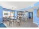 Bright dining area with glass table and kitchen access at 1625 S Ocean Blvd. # 1305, North Myrtle Beach, SC 29582