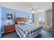 King-size bed, ocean view, and ceiling fan in this bedroom at 1625 S Ocean Blvd. # 1305, North Myrtle Beach, SC 29582