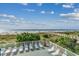 Beachfront view with lounge chairs and boardwalk access at 1625 S Ocean Blvd. # 1305, North Myrtle Beach, SC 29582