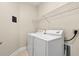 Bright laundry room with washer, dryer, and ample shelving at 84 S Addison Cottage Way # 213, Murrells Inlet, SC 29576