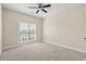 Bedroom featuring carpet, large window, and ceiling fan at 84 S Addison Cottage Way # 213, Murrells Inlet, SC 29576