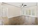Spacious living room with tile floors and access to balcony at 84 S Addison Cottage Way # 213, Murrells Inlet, SC 29576