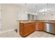 Kitchen with granite countertops and wood cabinets at 84 S Addison Cottage Way # 213, Murrells Inlet, SC 29576