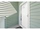Exterior view of a building entrance with a green door at 84 S Addison Cottage Way # 213, Murrells Inlet, SC 29576